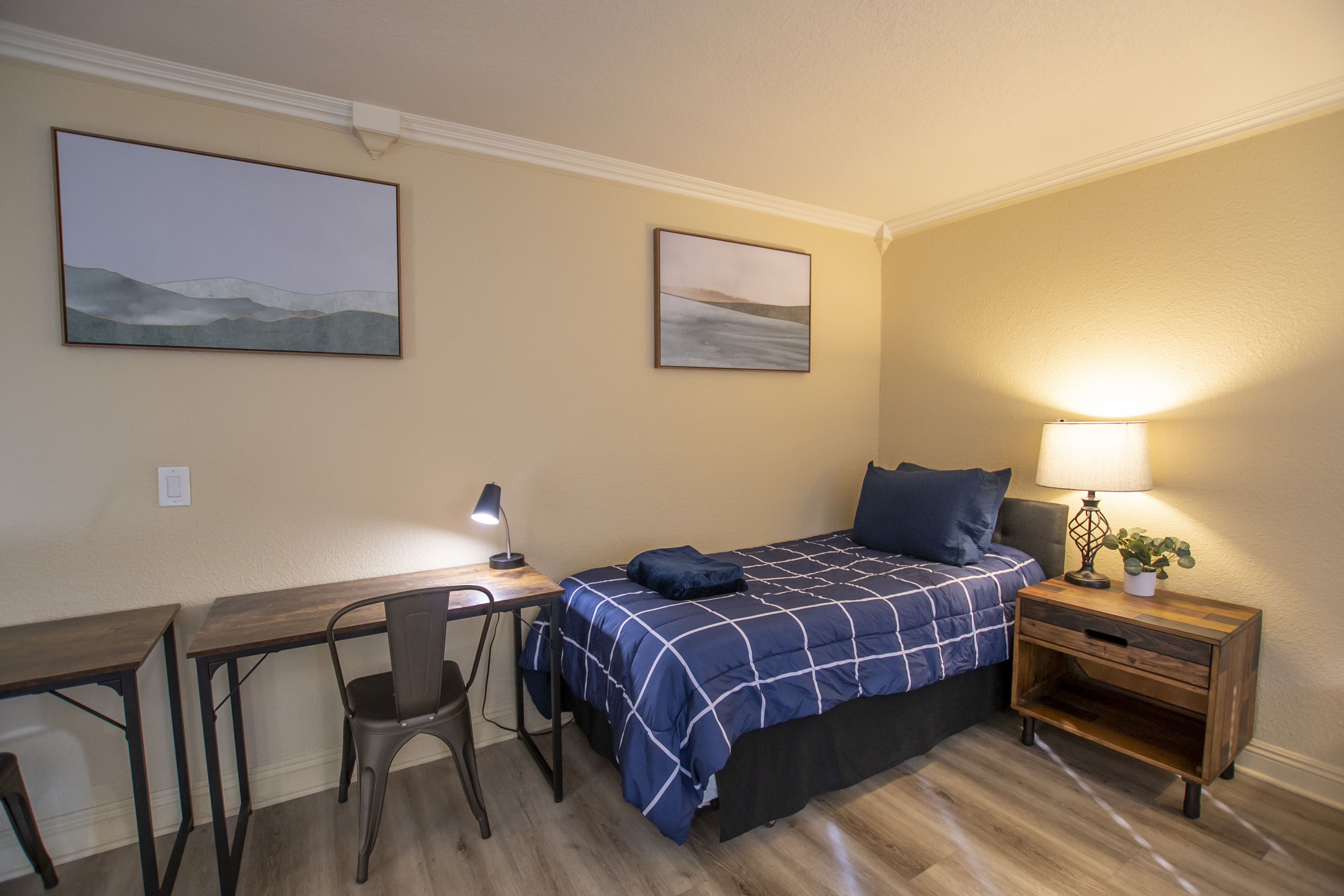 Twin bed with desk and reading lamp