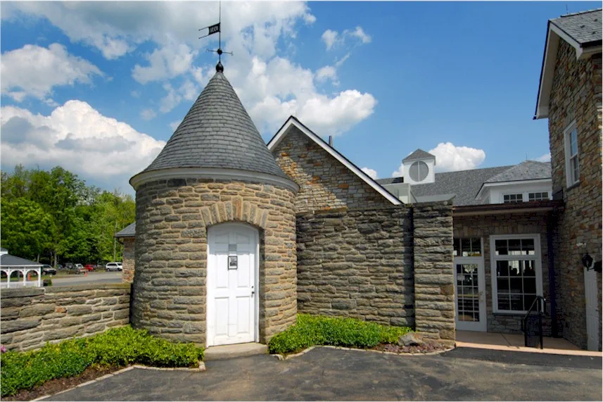 Stone tower entrance and exterior building walkway.