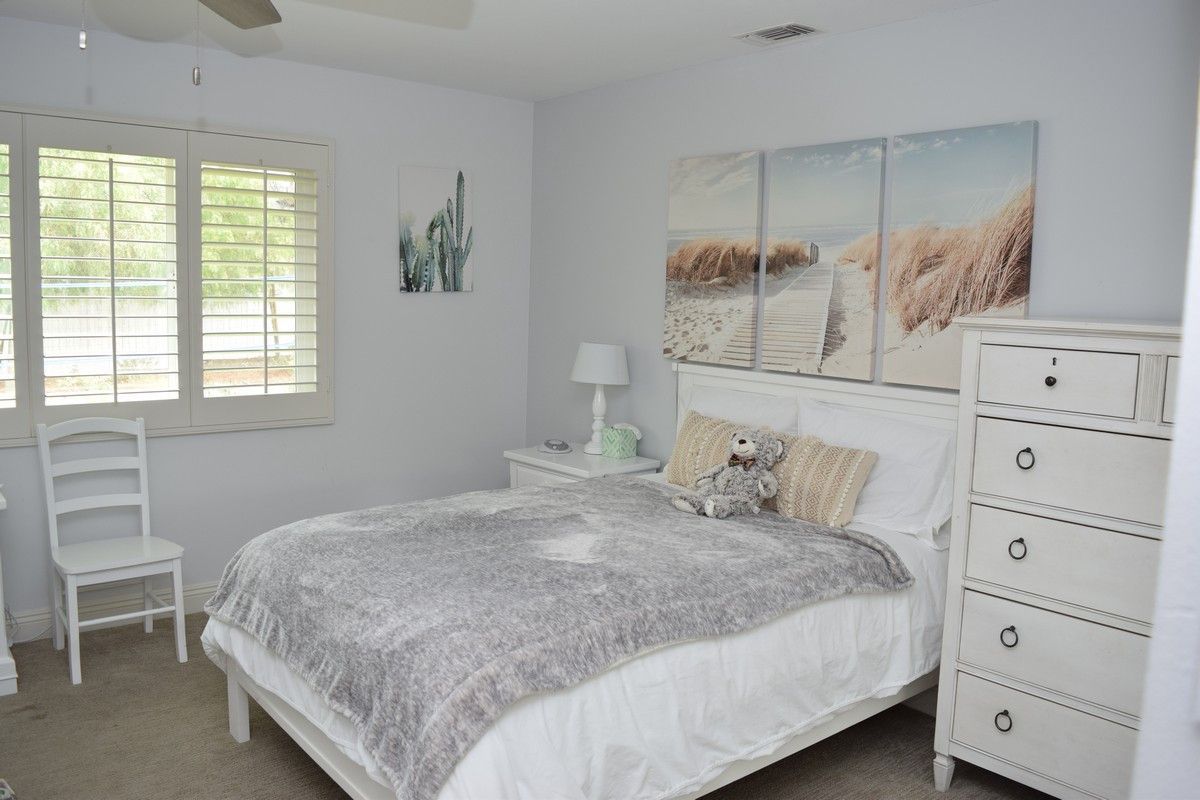 Cozy single bedroom with beach-themed decor			
