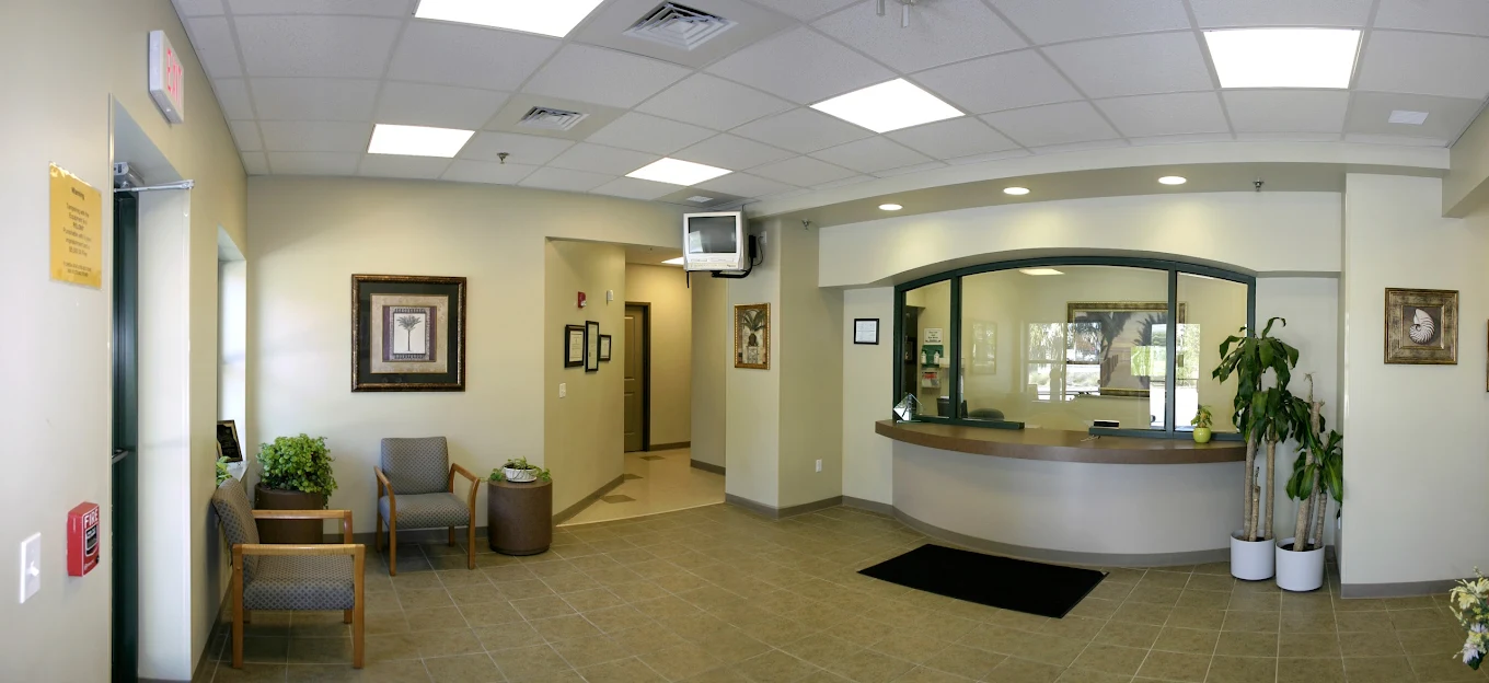 Front desk with seating and large interior window