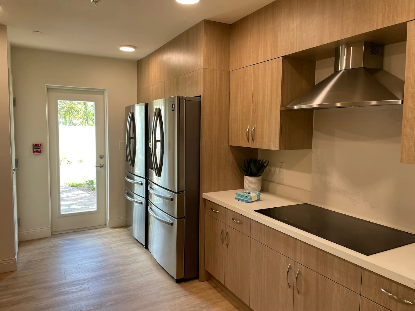Modern kitchen with wood cabinets and stainless appliances