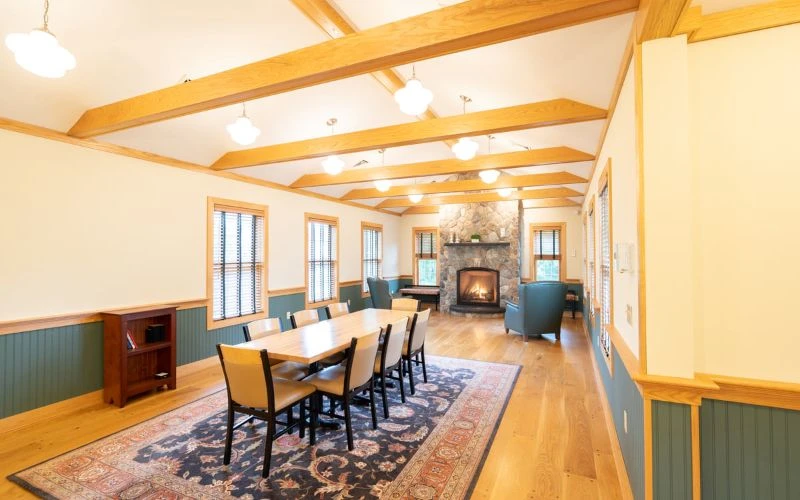 Dining room with fireplace and long table