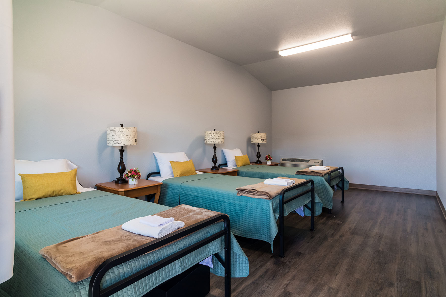 Shared bedroom with multiple single beds