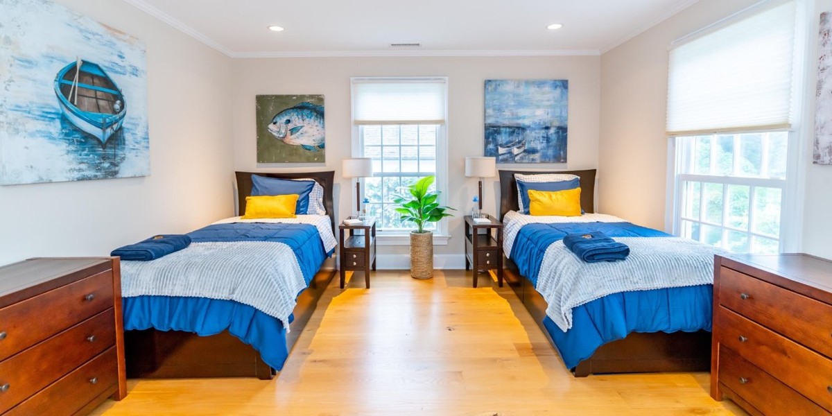 Bright bedroom with two twin beds and nautical decor