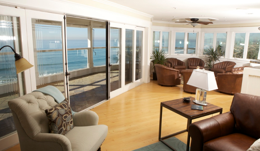 Cozy lounge with ocean-facing windows.
