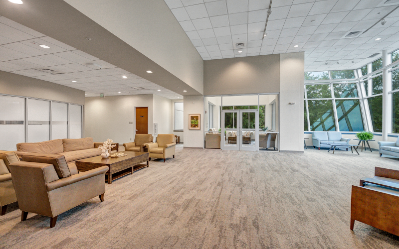 Common area overlooking wooded surroundings