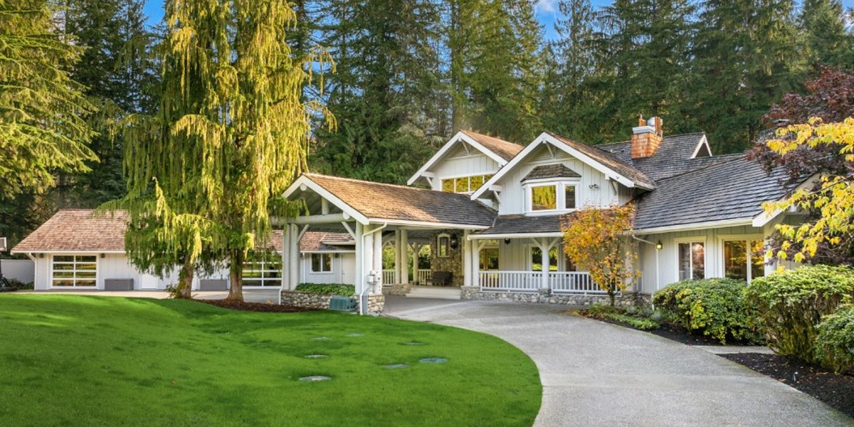 Front view of lodge-style facility surrounded by trees