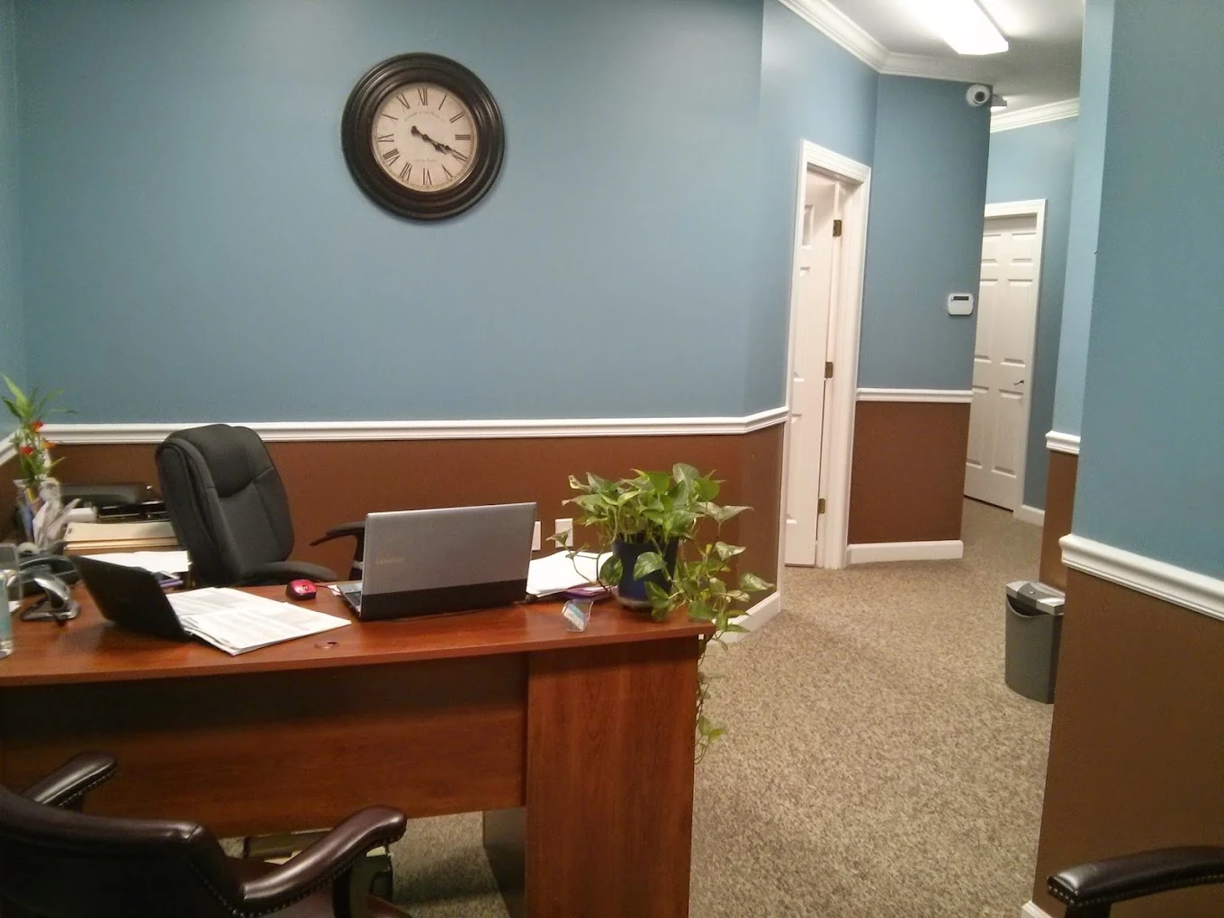 Office desk and hallway inside Absolute Advocacy in Concord