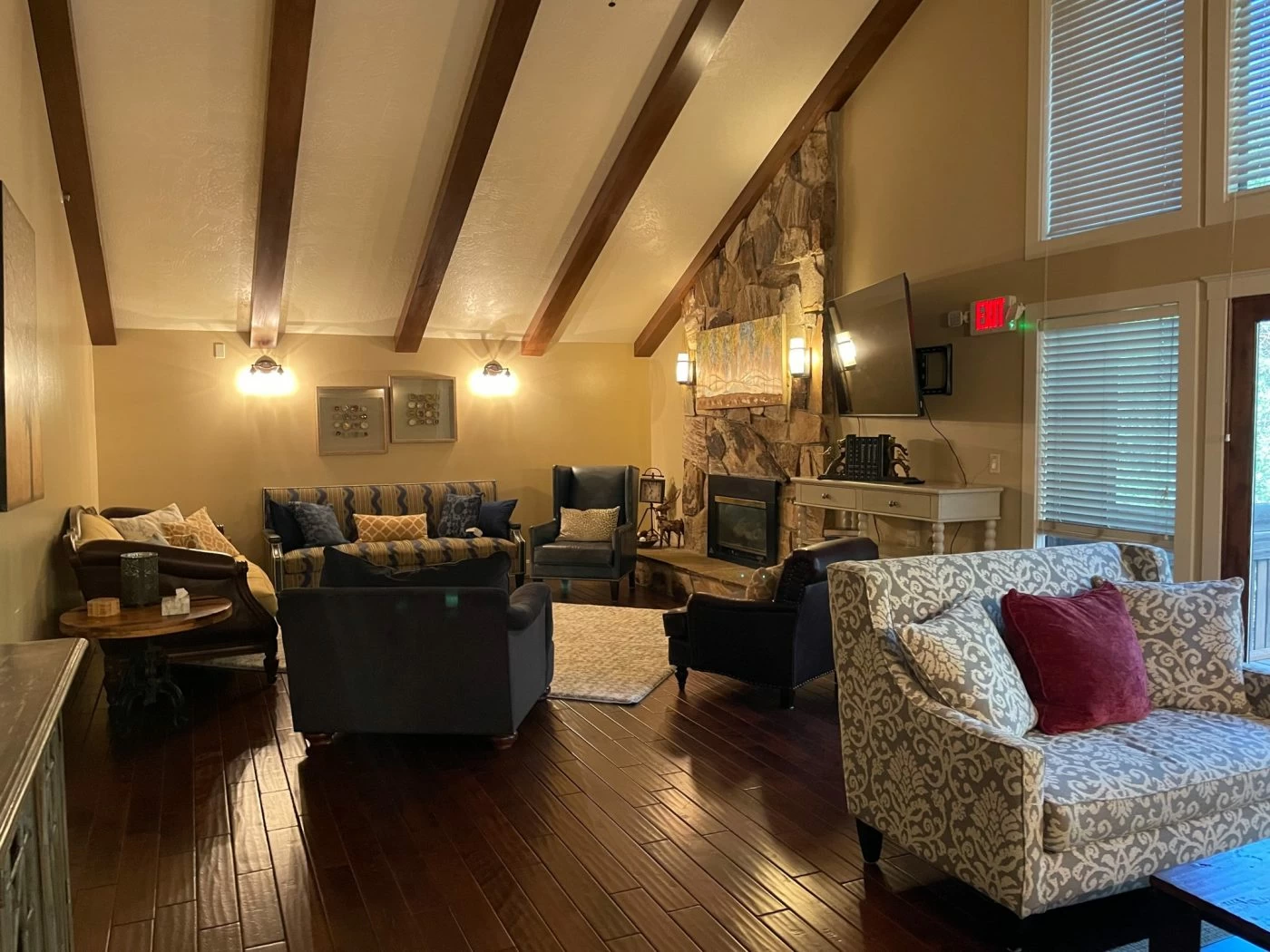 Cozy lounge with fireplace and wood beams