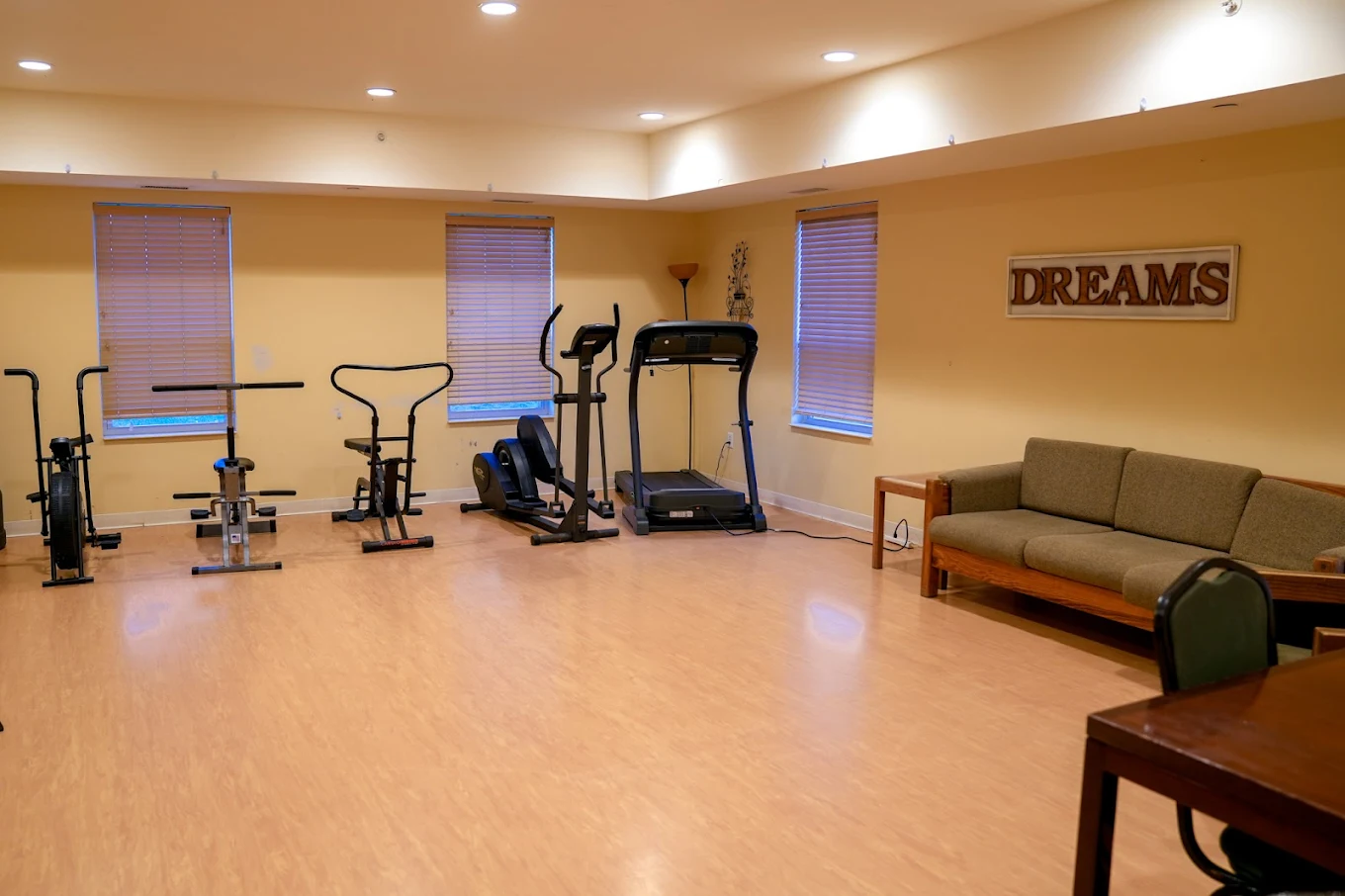 Fitness room with treadmill and exercise bikes