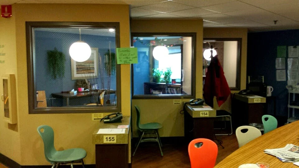 Community space with group seating and staff stations