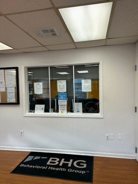 Reception window with check-in counter and BHG entrance mat