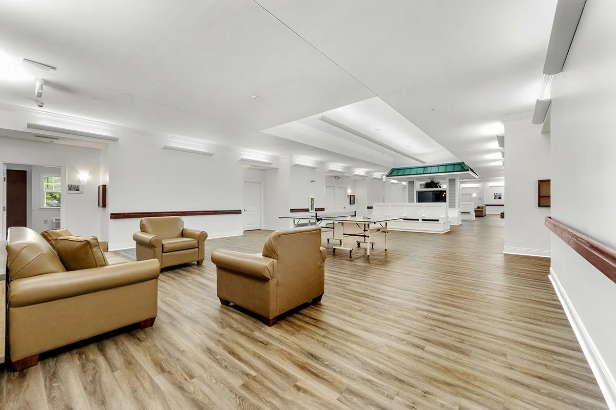 Recreation lounge with lounge seating, ping pong table, and communal entertainment space