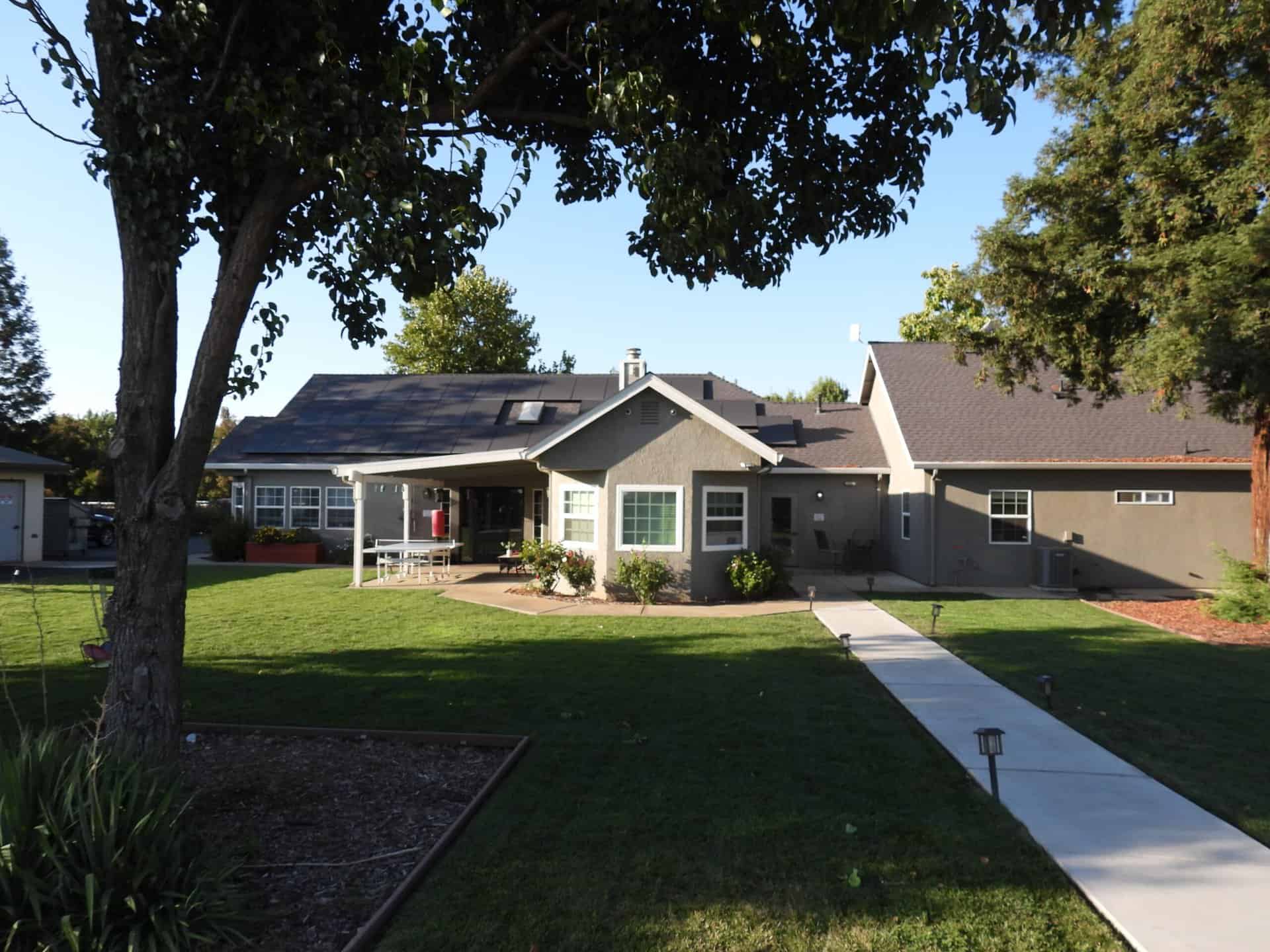 Exterior view of the recovery center with lawn and walkway