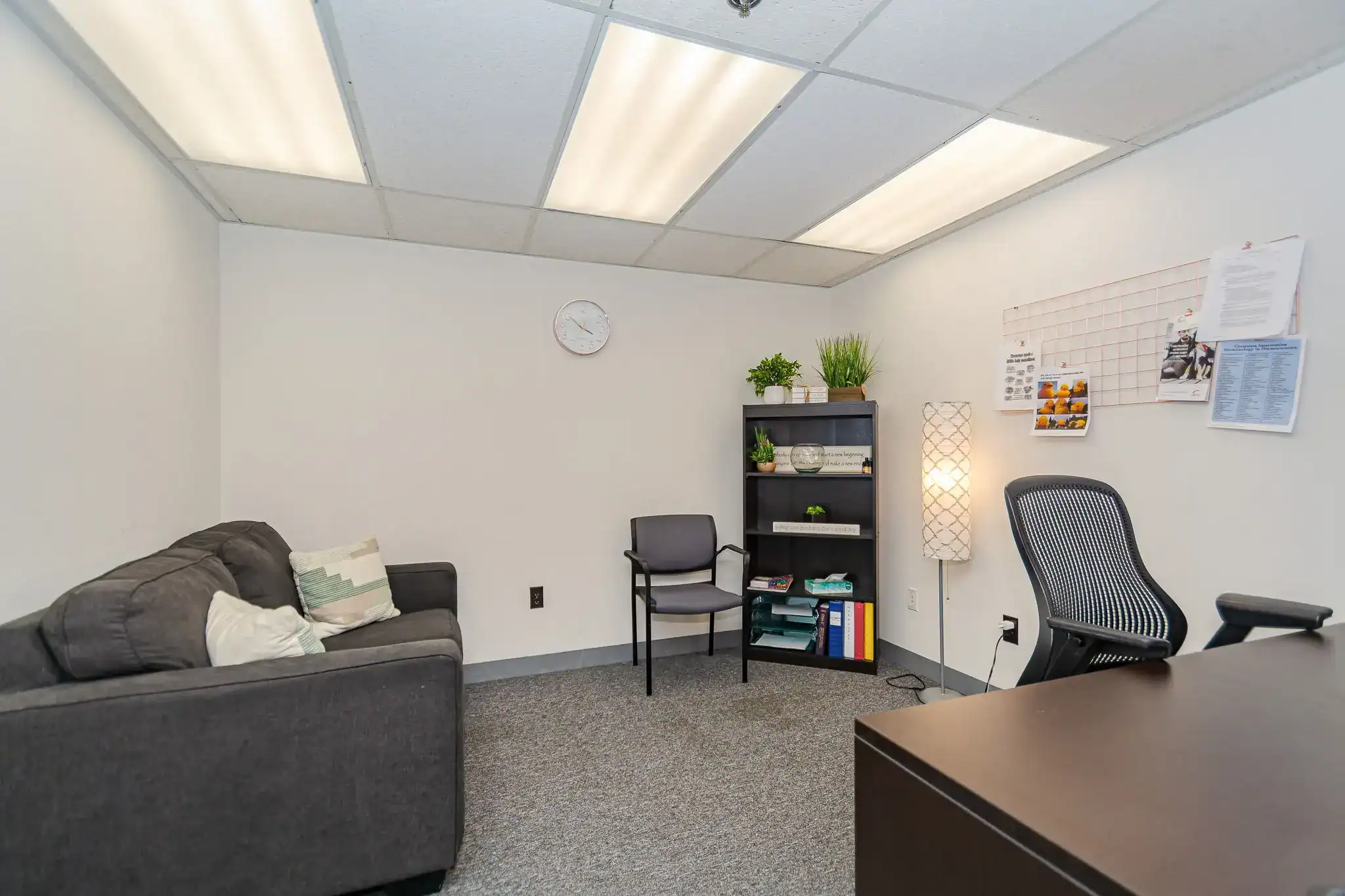 Counseling room with sofa and bookshelf