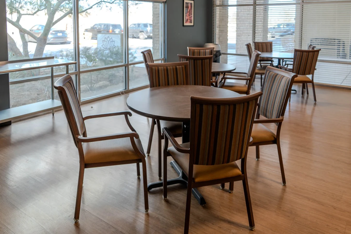 Dining area with round tables and striped chairs