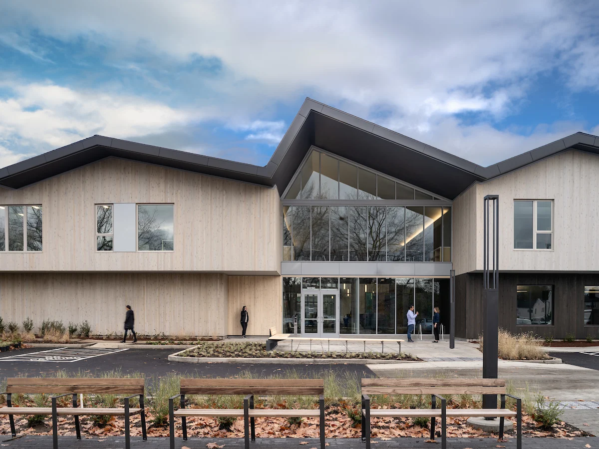 Modern Fora Health building with glass entrance and benches