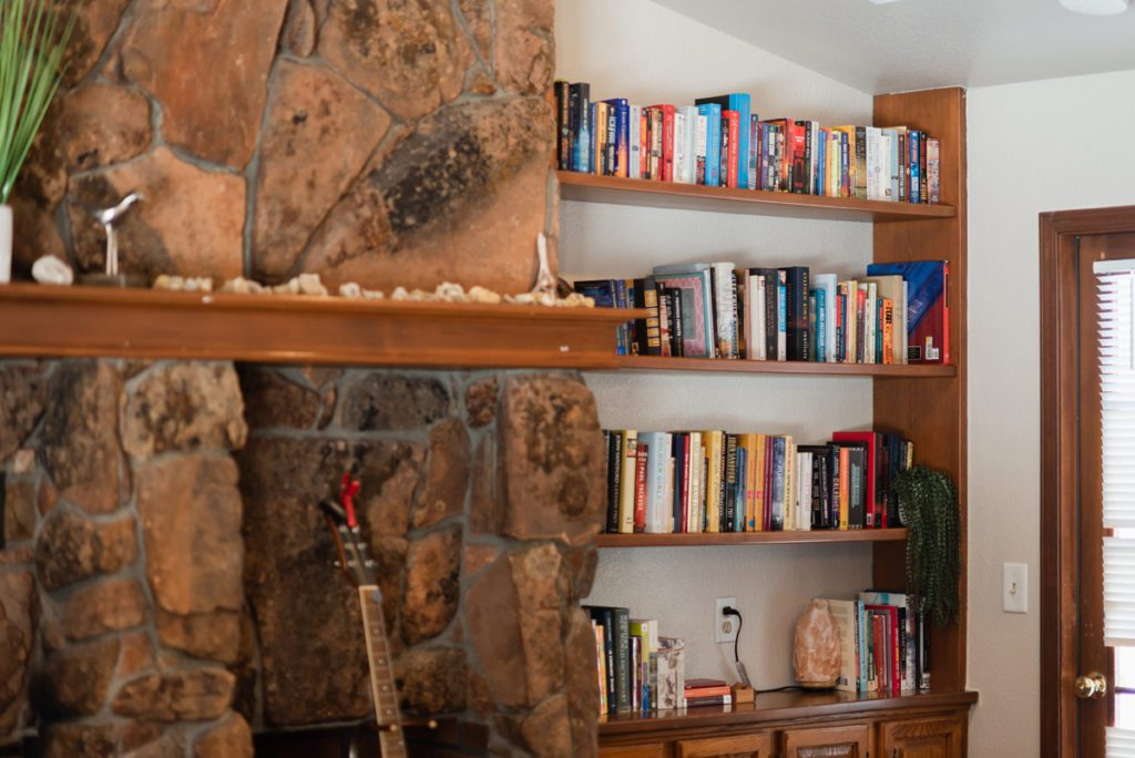 Cozy library corner with full wooden bookshelves