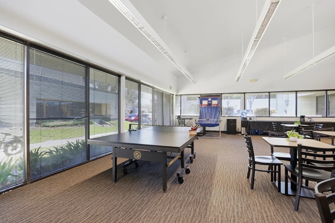 Recreation area with ping pong table and basketball game