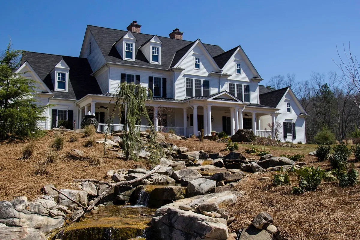 Large residential treatment home with landscaped grounds