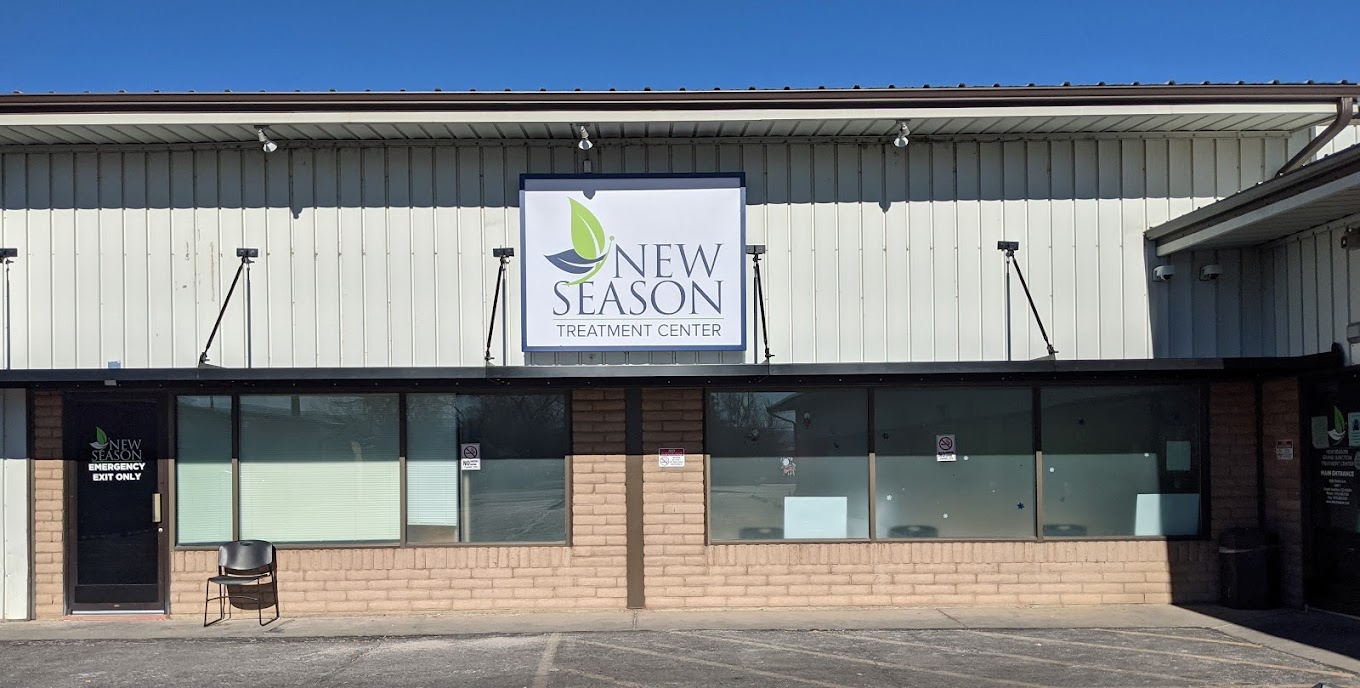 Front entrance of New Season Treatment Center with a large sign.