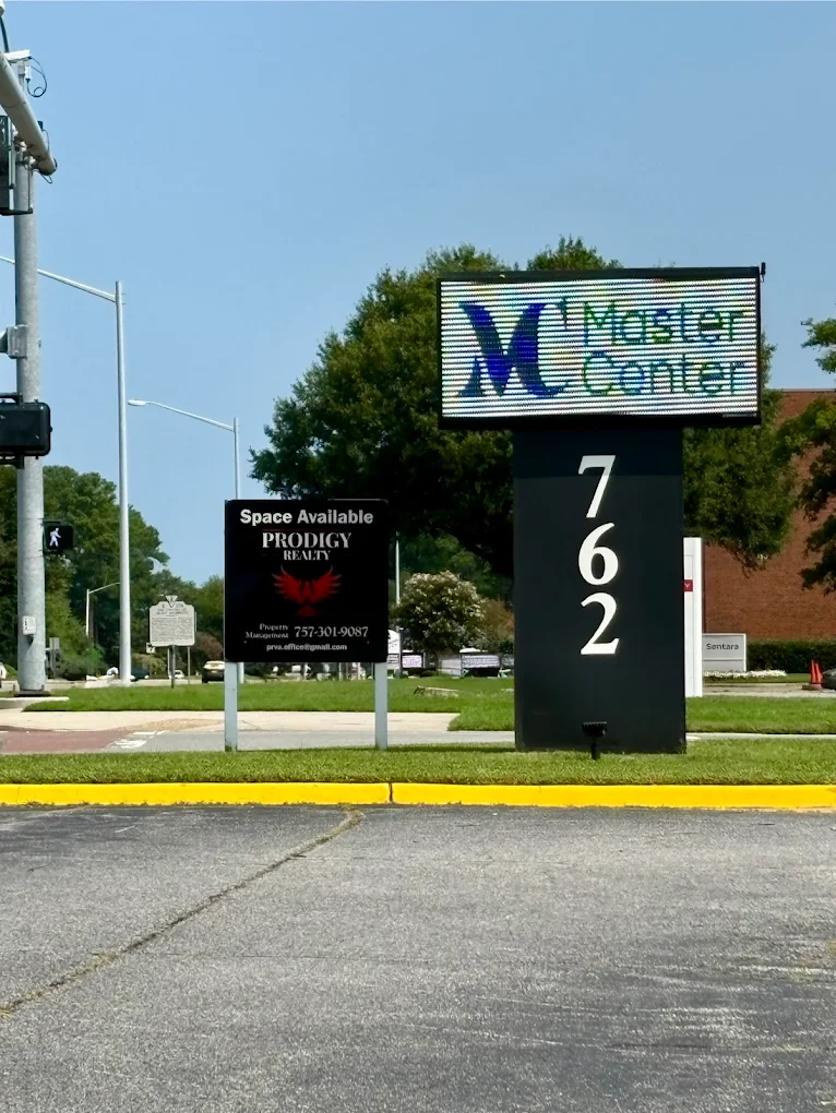 Master Center roadside sign displaying the facility address