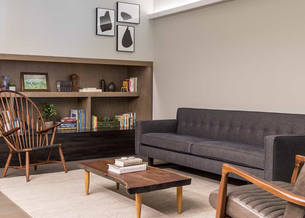 Gray sofa and bookshelf in calm reception space