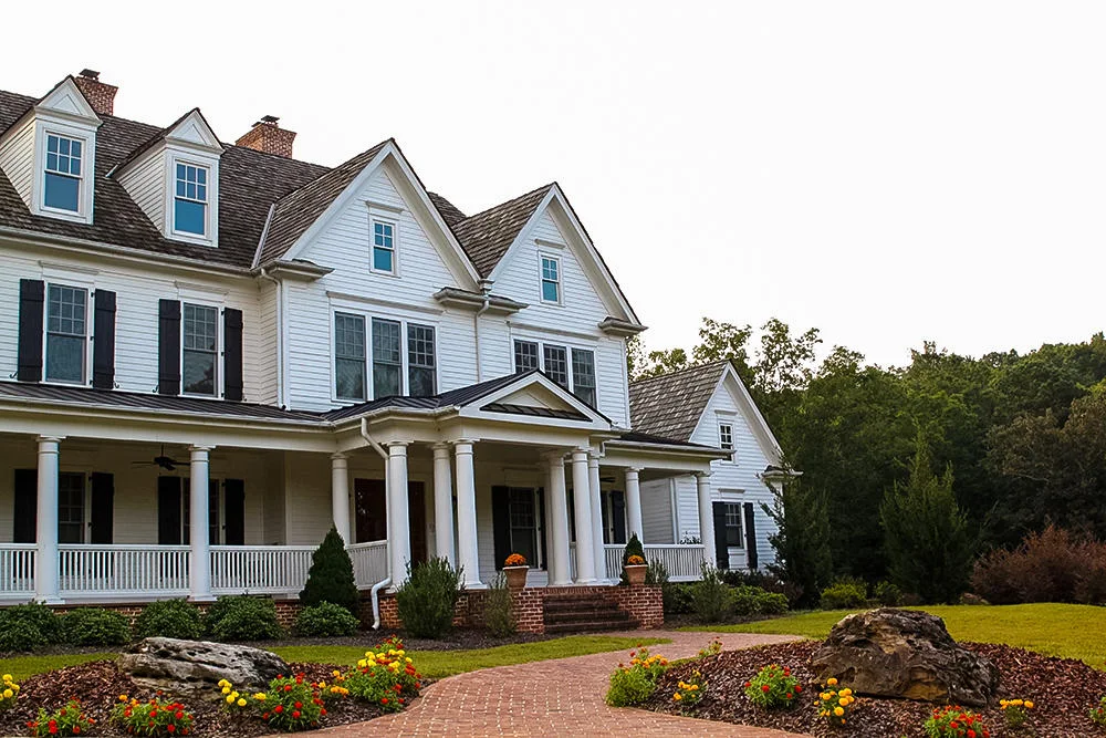 Large residential treatment home with landscaped grounds