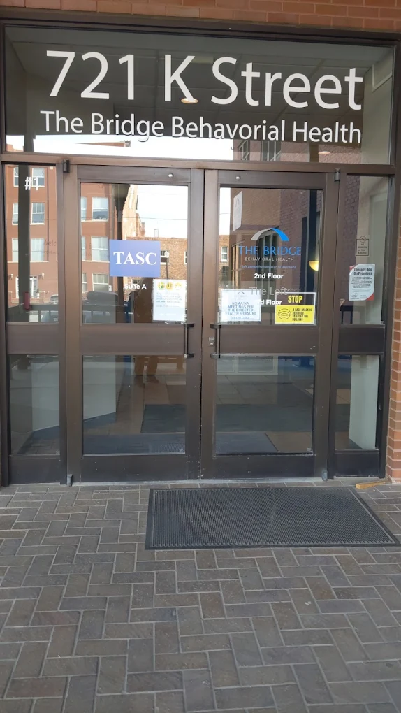 Glass entry doors of The Bridge Behavioral Health facility