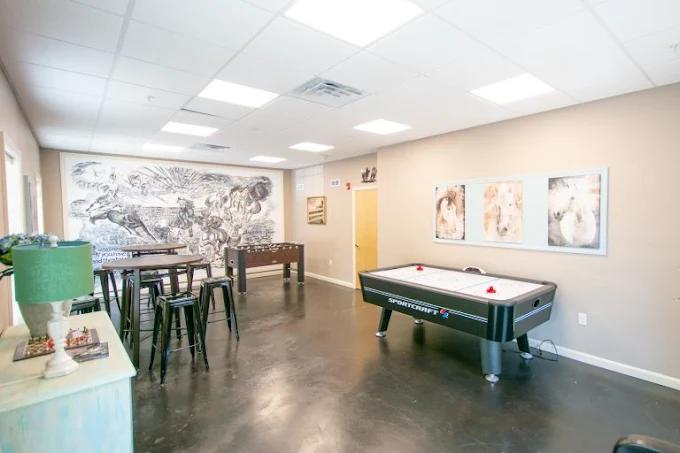 Air hockey and foosball tables in recreation area