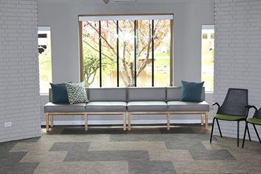 Window seating with cushions and outdoor view