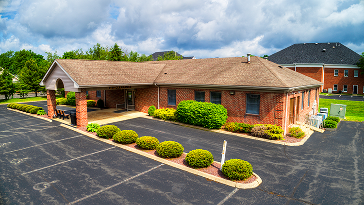 Exterior of BrightView Health Youngstown in a single-story brick building with covered entrance, parking lot, and landscaped shrubs