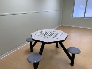 Hexagon table with fixed stools and game board top