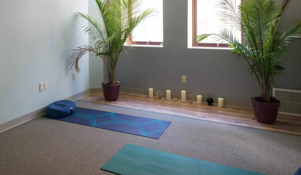 Yoga and meditation room with mats and plants