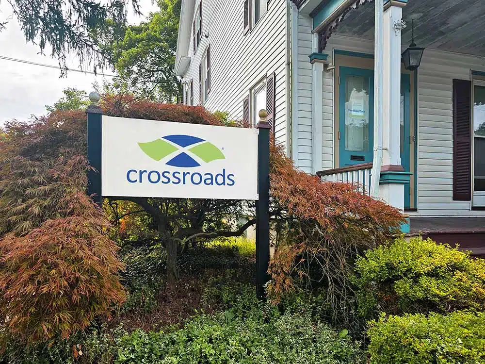 Crossroads treatment center sign outside residential-style building