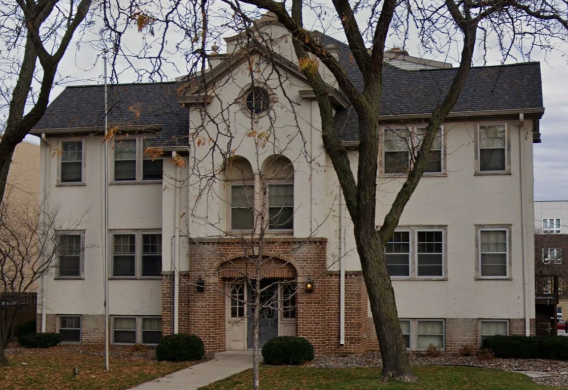 Front entrance to Pathway House Men’s Program, a cozy brick home with mature trees and a welcoming atmosphere.