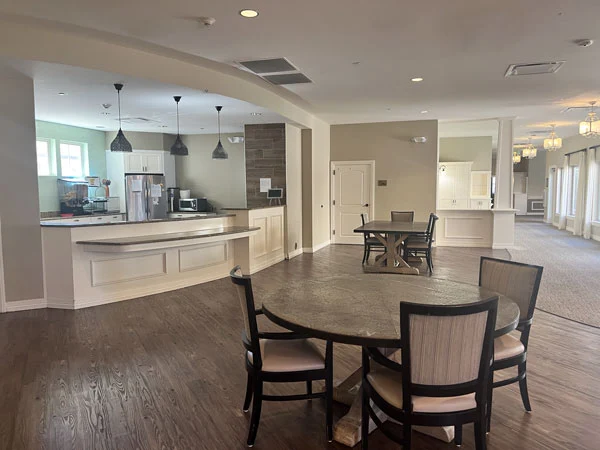 Open kitchen and dining area with tables and seating