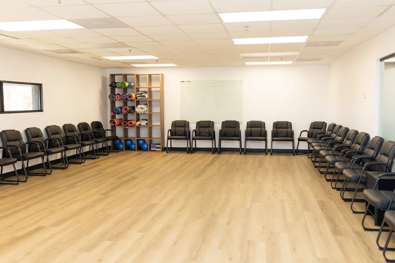 Group room with chairs arranged around an open floor