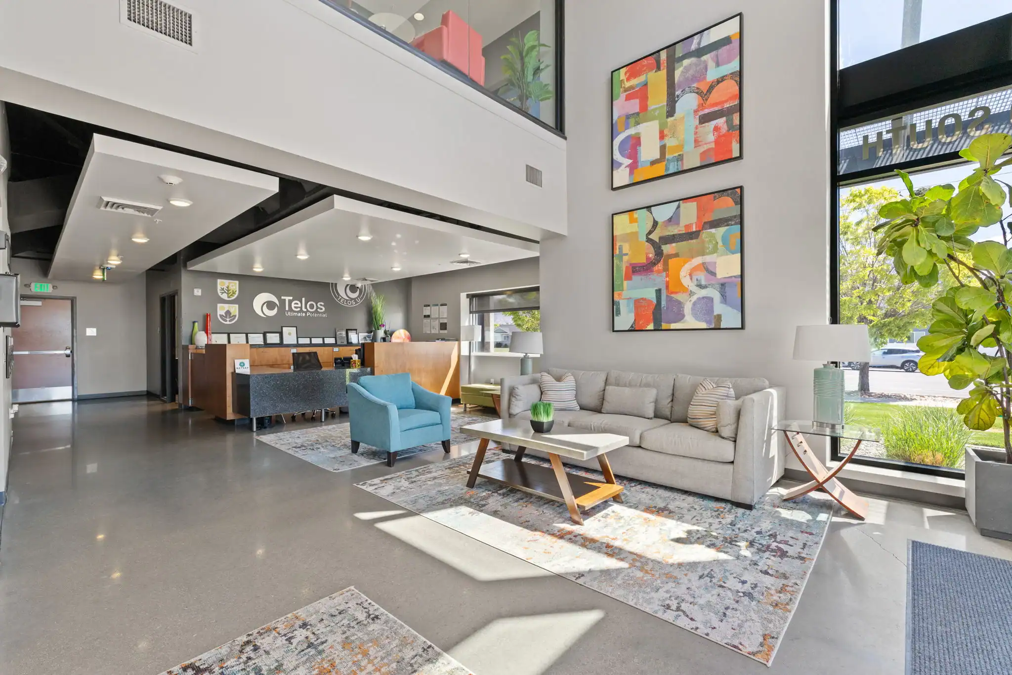Bright reception lobby with seating and front desk