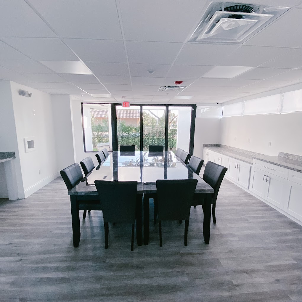 Conference room with a table, chairs. and windows.