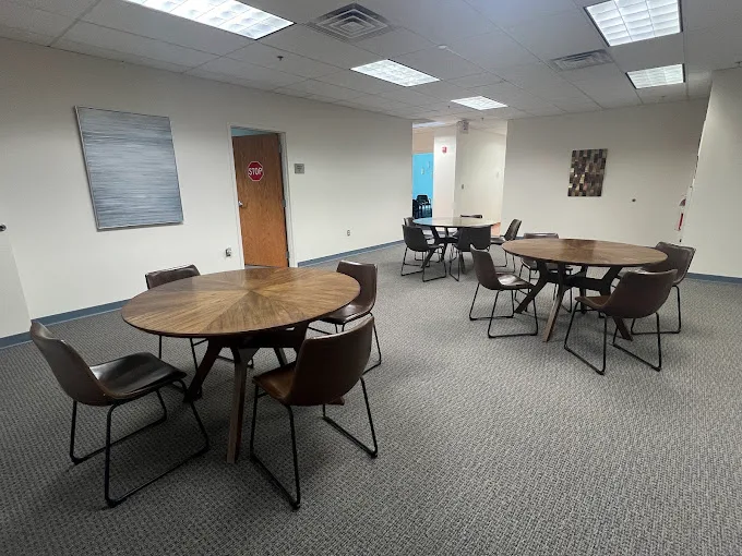Room with round tables and chairs for group meetings