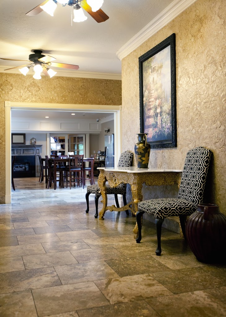 Elegant hallway with chairs and gold-accented table