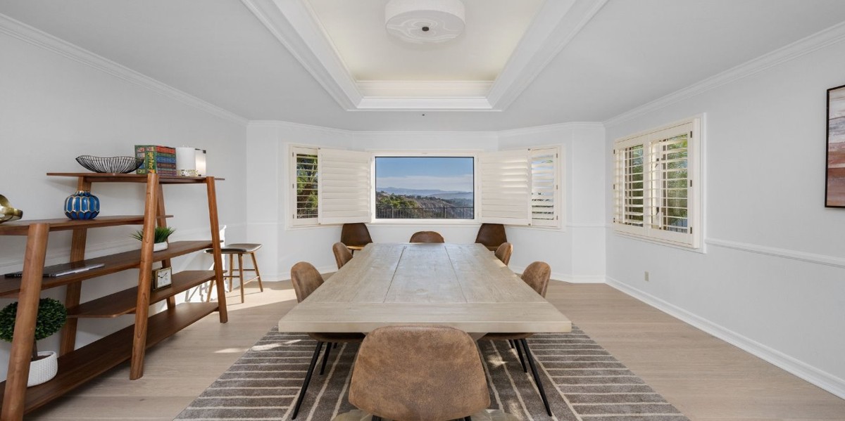 Meeting room with long table and scenic window view