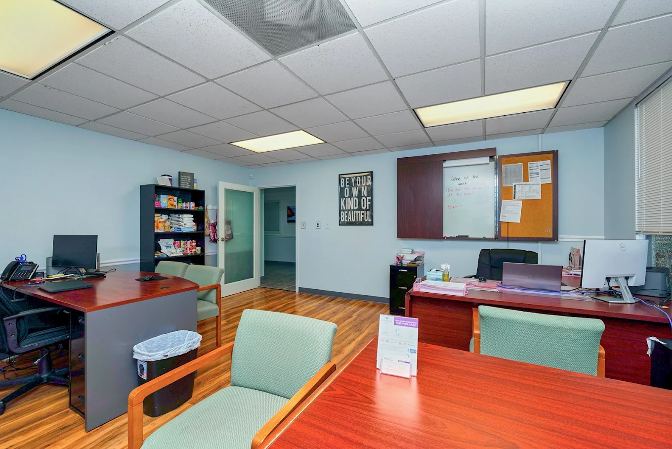 Reception office with staff workstations and patient seating