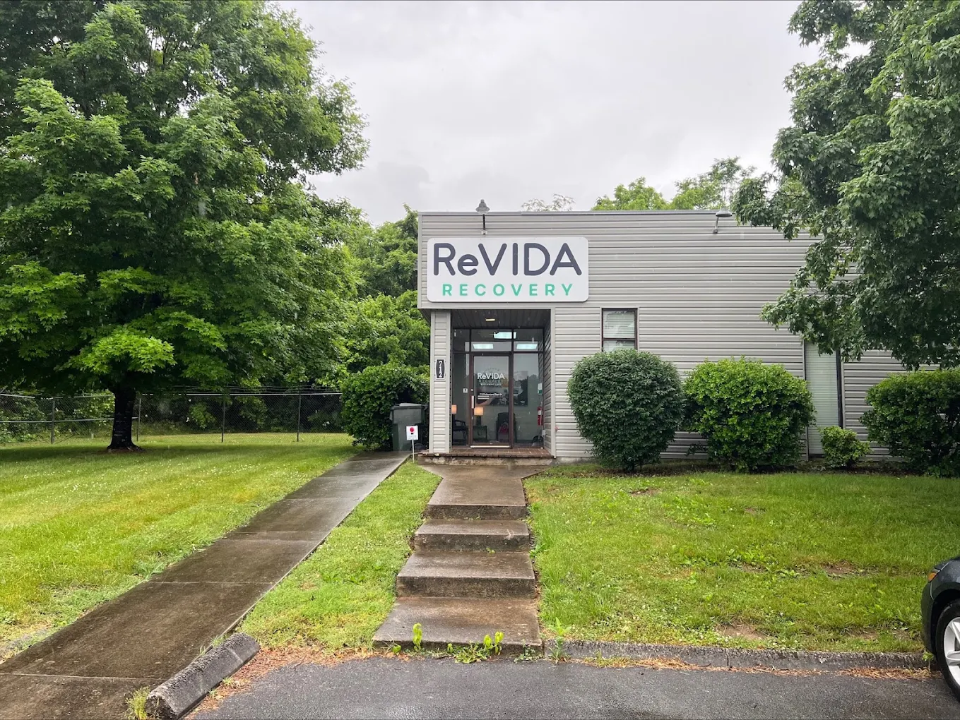 ReVIDA Recovery building exterior with entrance and greenery