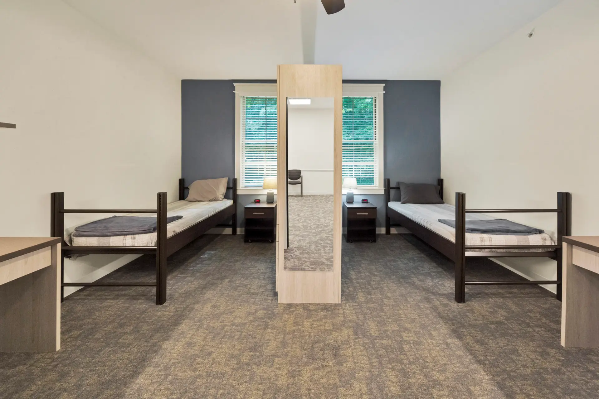 Shared bedroom with two twin beds and nightstands