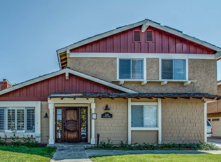 Two-story rehab center exterior with wood door