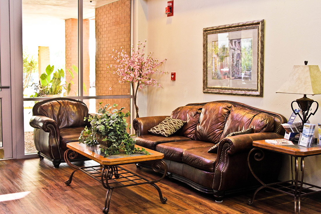 Comfortable lobby seating area with leather sofas and coffee table