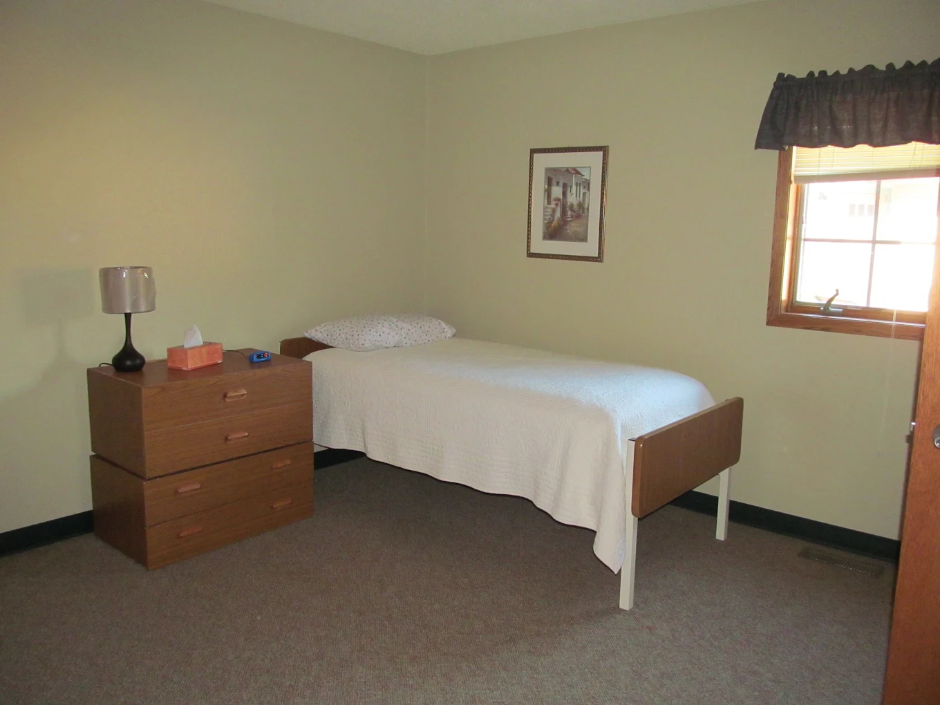 Private bedroom with single bed and dresser