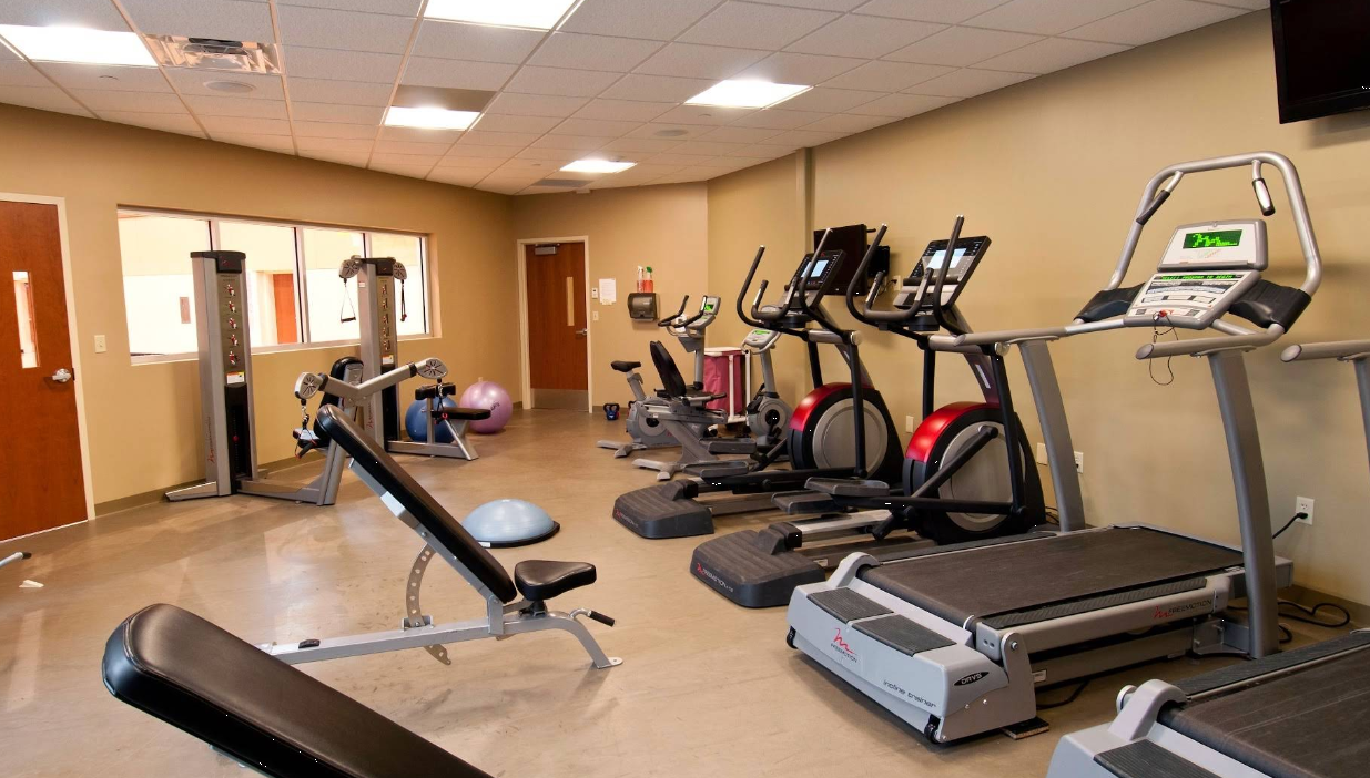 Fitness room with treadmills, ellipticals, and strength equipment
